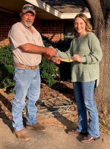 Kevin Spreen of the Runnels SWCD presents Keni Jo Drennan with her scholarship award.